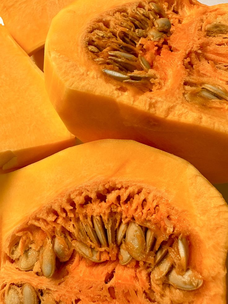 A halved pumpkin with seeds