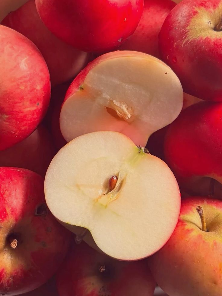 Red apples, one cut in half